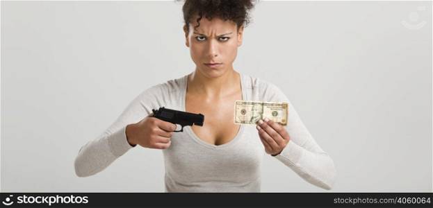 African woman shooting a US-Dollar banknote, great concept for the global crises