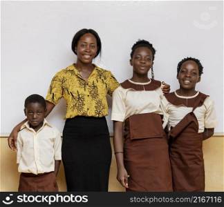 african woman teaching children class