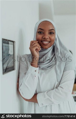 African woman using a smart home screen control system. High-quality photo. African woman using smart home screen control system