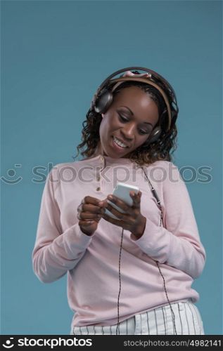 African woman with headphones listening music
