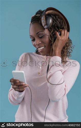 African woman with headphones listening music