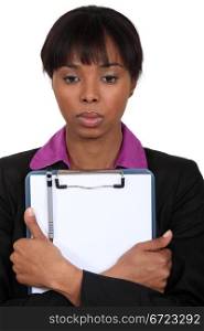 Afro-American businesswoman holding a notepad