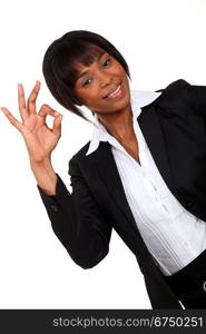 Afro-American businesswoman making an OK sign