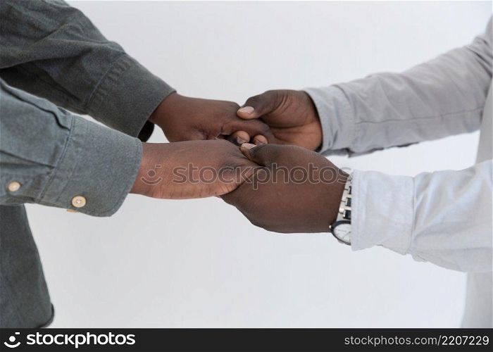 afro american people hands holding each other