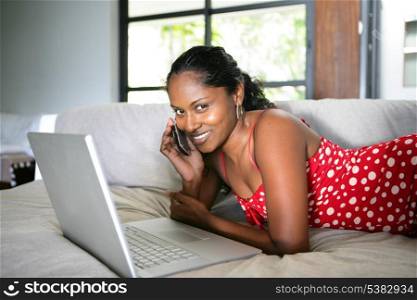 Afro-American woman relaxing on the couch