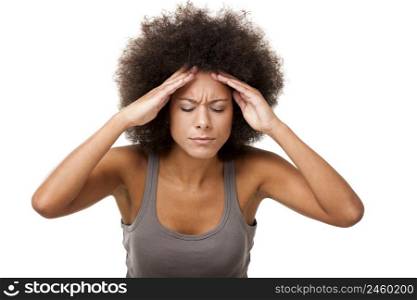 Afro-American young woman sufering with a headache isolated on white