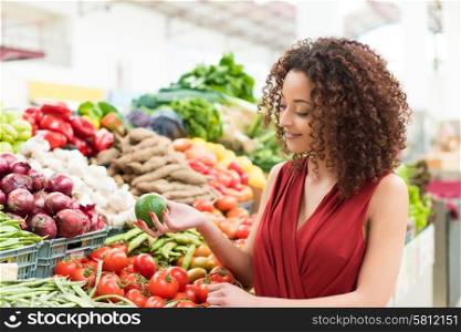 Afro woman shopping organic veggies and fruits