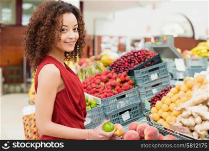Afro woman shopping organic veggies and fruits