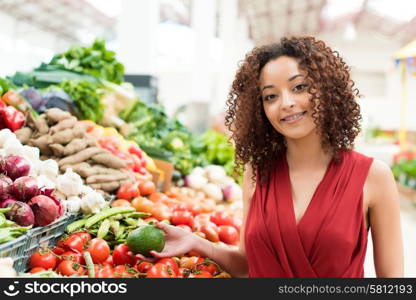 Afro woman shopping organic veggies and fruits