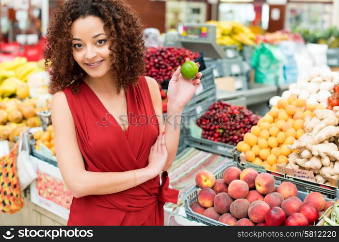 Afro woman shopping organic veggies and fruits