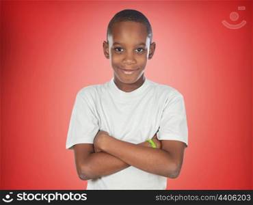 Afroamerican teenager boy on a red background