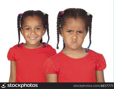 Afroamerican twins with braids. One happy and the other very angry isolated on a white background