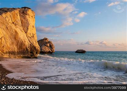 Afternoon view of breaking waves at the beach around Petra tou Romiou, in Paphos, Cyprus. It is considered to be Aphrodite&rsquo;s birthplace in Greek mythology.