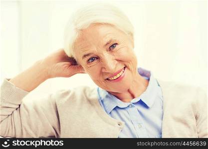 age and people concept - happy smiling senior woman at home. happy senior woman face at home