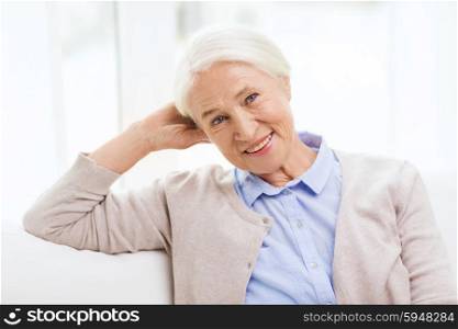 age and people concept - happy smiling senior woman at home. happy senior woman at home