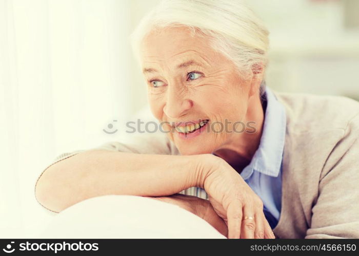 age and people concept - happy smiling senior woman face at home. happy senior woman face at home