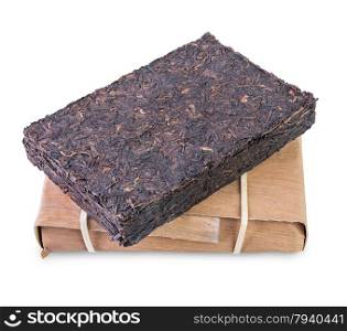 Aged chinese puer tea brick and pack of bamboo shoots isolated on white