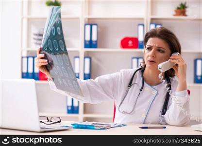 Aged female doctor radiologist in the clinic