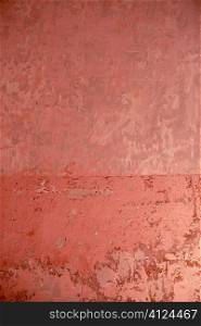 Aged grunge wall pink texture scraped old paint interior
