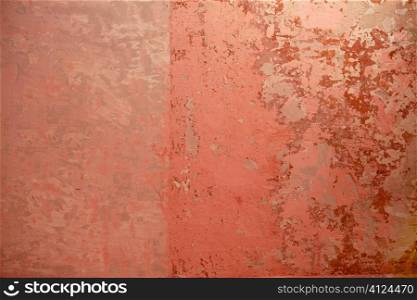 Aged grunge wall pink texture scraped old paint interior