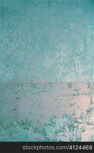 Aged grunge wall turquoise blue texture scraped old paint interior