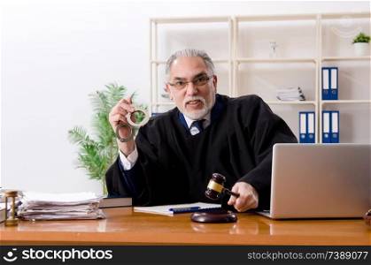 Aged lawyer working in the courthouse  