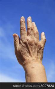 Aged people&acute;s hand