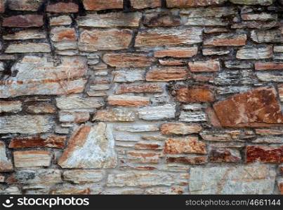 Aged stone wall by the time