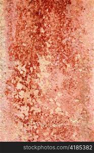 Aged weathered painted wall in red tones good as grunge background