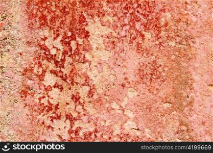 Aged weathered painted wall in red tones good as grunge background