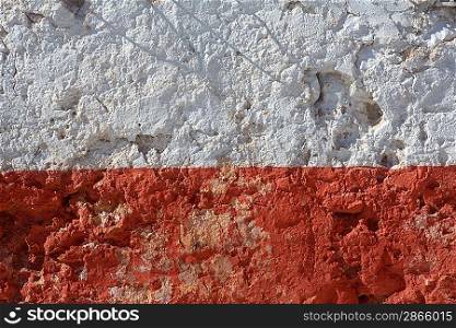 Aged whitewashed wall with red grunge paint wheatered