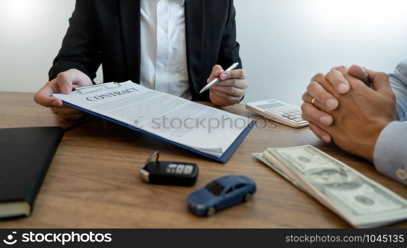 agent broker man holding document showing an transportation contract form to client ownership customer and salesman with car key