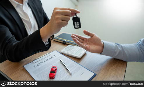 agent broker man holding document showing an transportation contract form to client ownership customer and salesman with car key