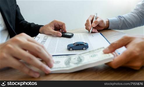agent broker man holding document showing an transportation contract form to client ownership customer and salesman with car key