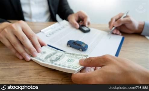 agent broker man holding document showing an transportation contract form to client ownership customer and salesman with car key