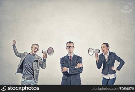 Aggression and humiliation in communication. Aggressive people screaming in megaphone on each other