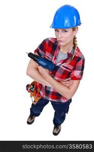 Aggressive female builder holding drill