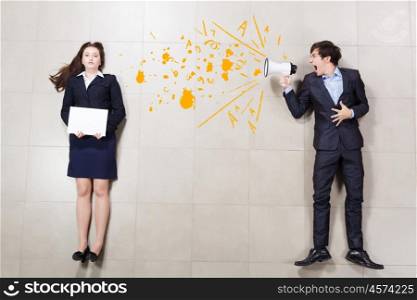 Aggressive management. Aggressive businessman shouting at colleague with megaphone