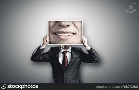 Aggressive manager. Businessman hiding head behind photo with huge mouth