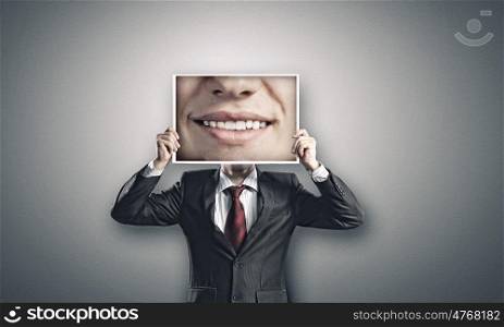 Aggressive manager. Businessman hiding head behind photo with huge mouth
