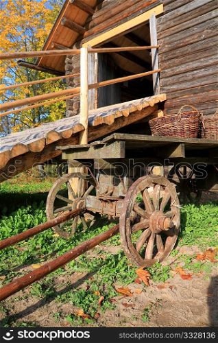 aging cart near wooden barn