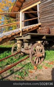 aging cart near wooden barn