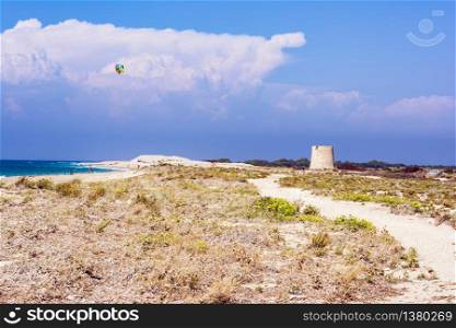 Agios Ioannis beach in Lefkas island Greece. Colorful power kites span across the sky from kite-surfers.. Agios Ioannis beach in Lefkas island Greece