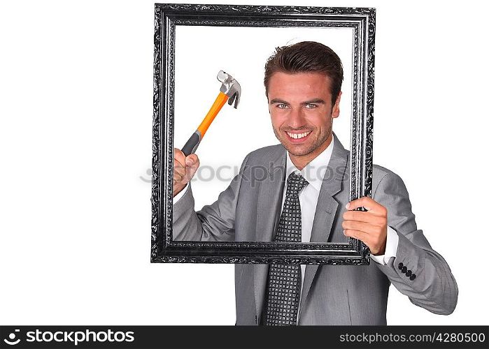 Agressive businessman with picture frame
