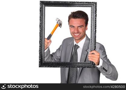 Agressive businessman with picture frame