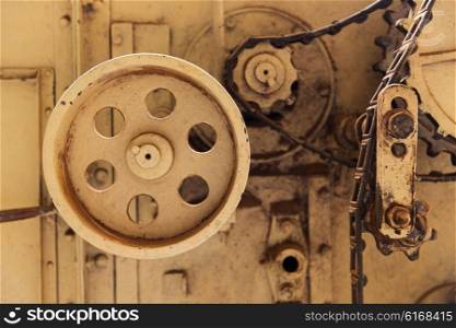 agriculture, manufacture, industry and farming concept - vintage machine mechanism at factory