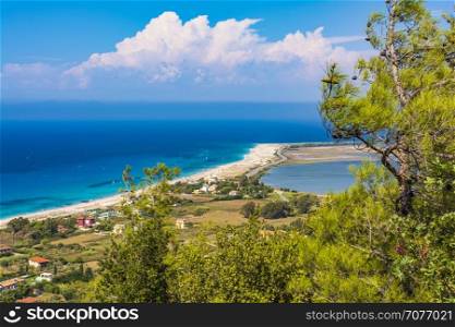 Ai Yiannis, Mili is a long sandy beach on the island of Lefkada, Greece. Preferred by wind and kite surfers. It covers a stretch of 4.5 km and the waters are turquoise coloured.