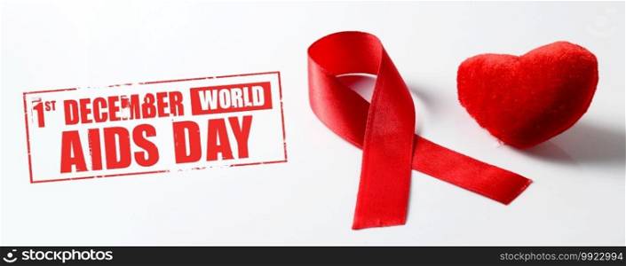 Aids ribbon and heart on white background.