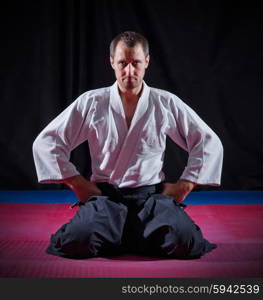 Aikido fighter on black background