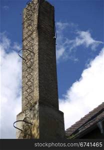 ailing chimney. ailing chimney on an old barracks in Kummersdorf, Germany